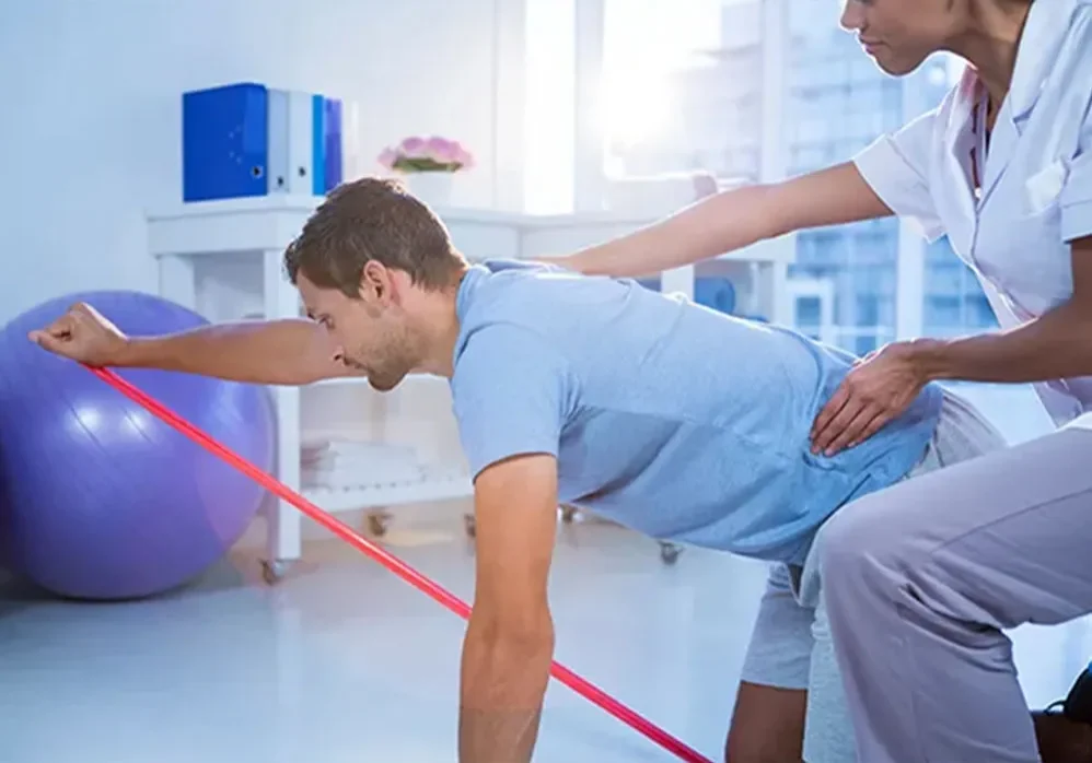 Man doing physical therapy with therapist.